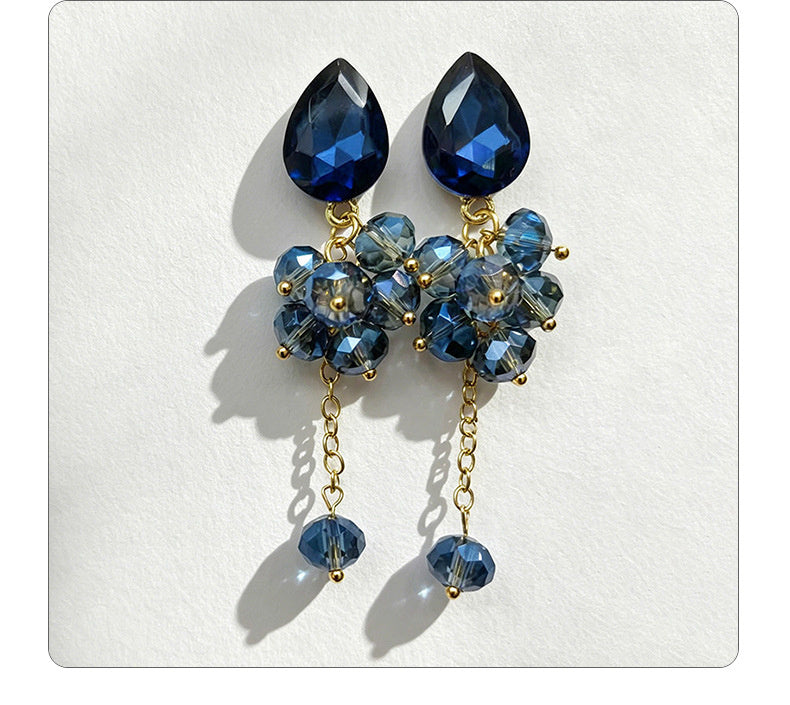 Teardrop-shaped gemstone earrings with multi-layered crystal beads and long tassel design