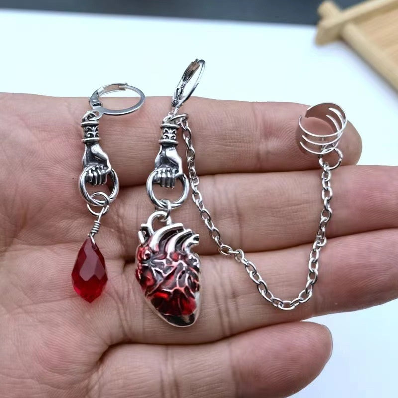 Dark-style jewelry: vintage pendant earrings, horn-shaped ruby earrings
