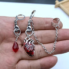 Dark-style jewelry: vintage pendant earrings, horn-shaped ruby earrings
