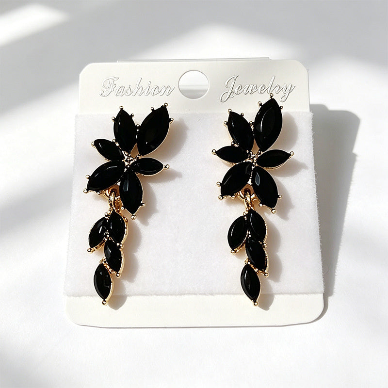Gilt and diamond-encrusted floral earrings, long earrings for a French elegant style photo shoot or date