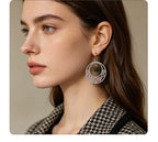 Irish-style woven pattern hollow earrings with distressed silver hoops and green jade beads, versatile for casual vacations