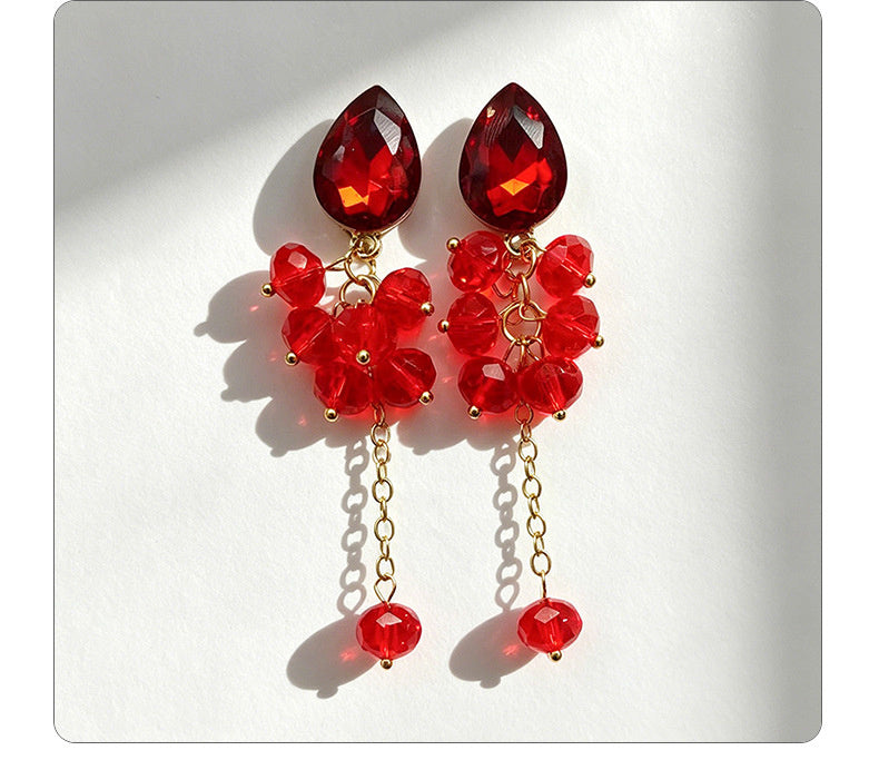 Teardrop-shaped gemstone earrings with multi-layered crystal beads and long tassel design