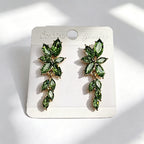 Gilt and diamond-encrusted floral earrings, long earrings for a French elegant style photo shoot or date