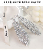 Fashionable feather for women, European American exaggerated retro cool style, stylish and unique hip-hop diamond-embellished leaf earrings
