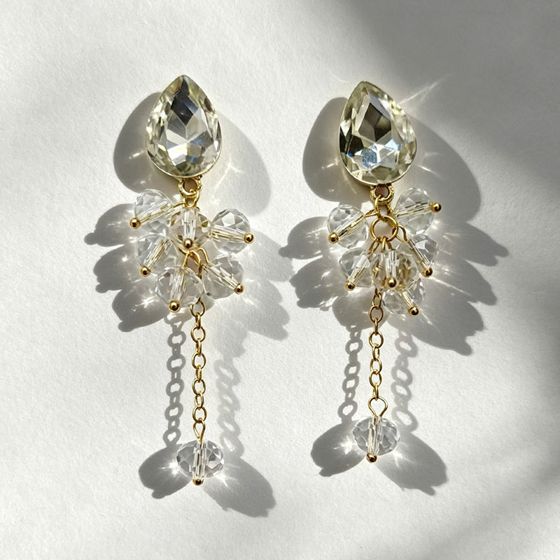 Teardrop-shaped gemstone earrings with multi-layered crystal beads and long tassel design