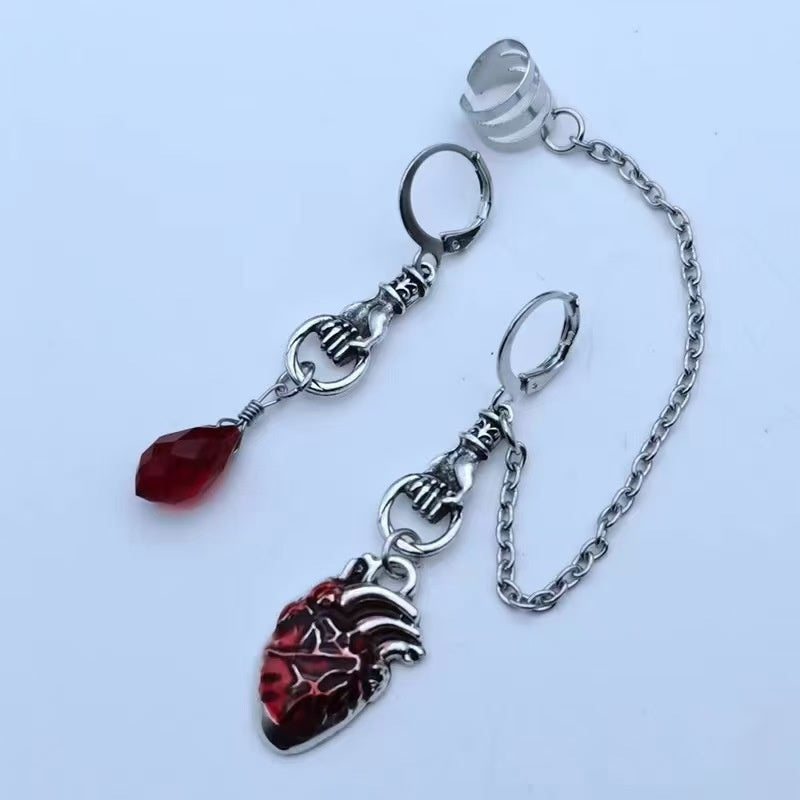 Dark-style jewelry: vintage pendant earrings, horn-shaped ruby earrings