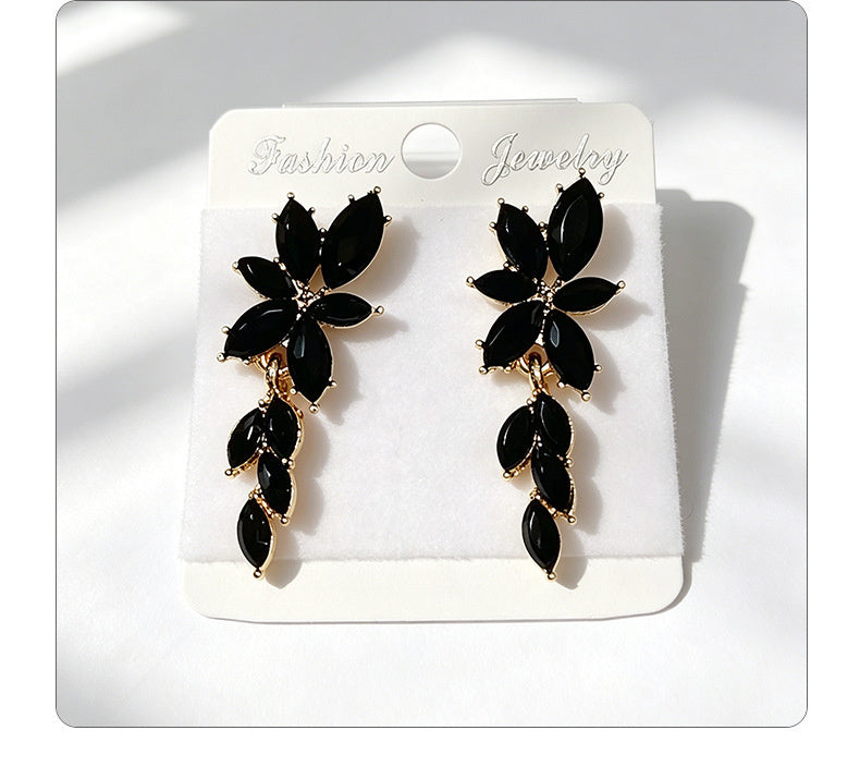 Gilt and diamond-encrusted floral earrings, long earrings for a French elegant style photo shoot or date