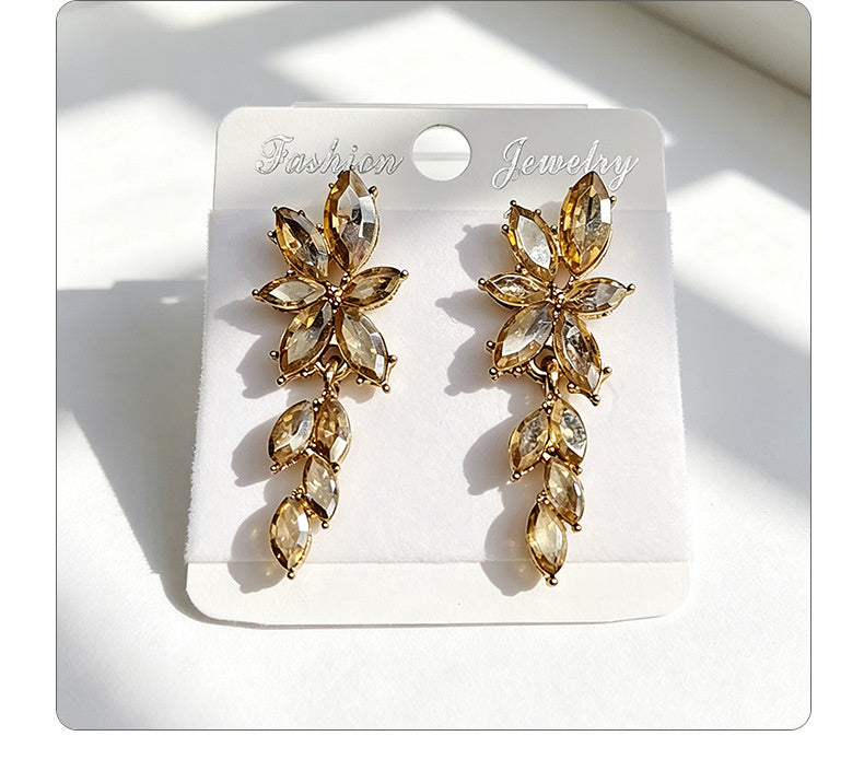 Gilt and diamond-encrusted floral earrings, long earrings for a French elegant style photo shoot or date