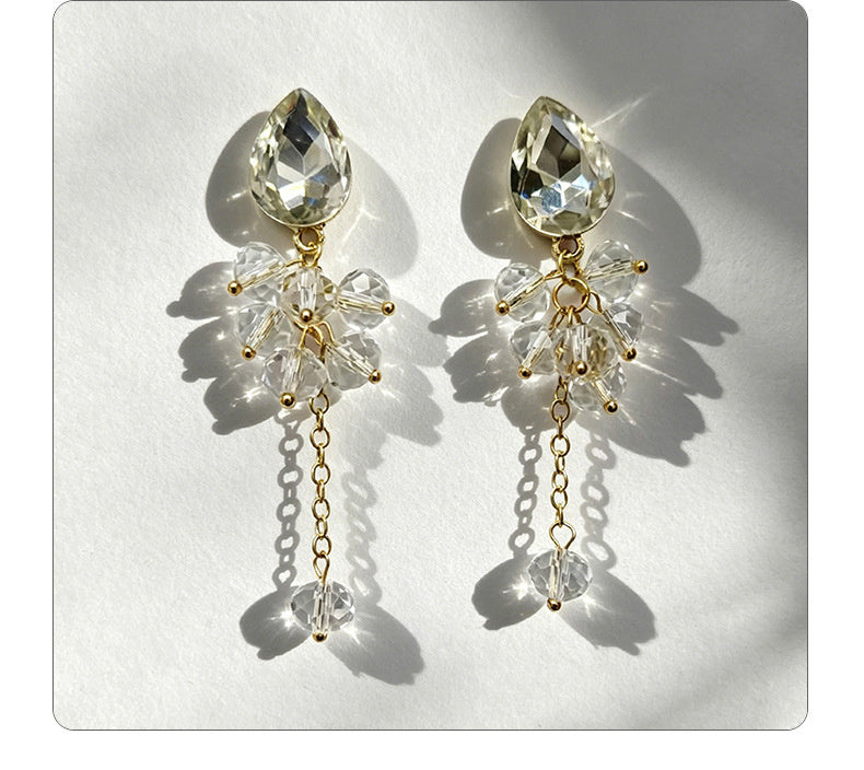 Teardrop-shaped gemstone earrings with multi-layered crystal beads and long tassel design
