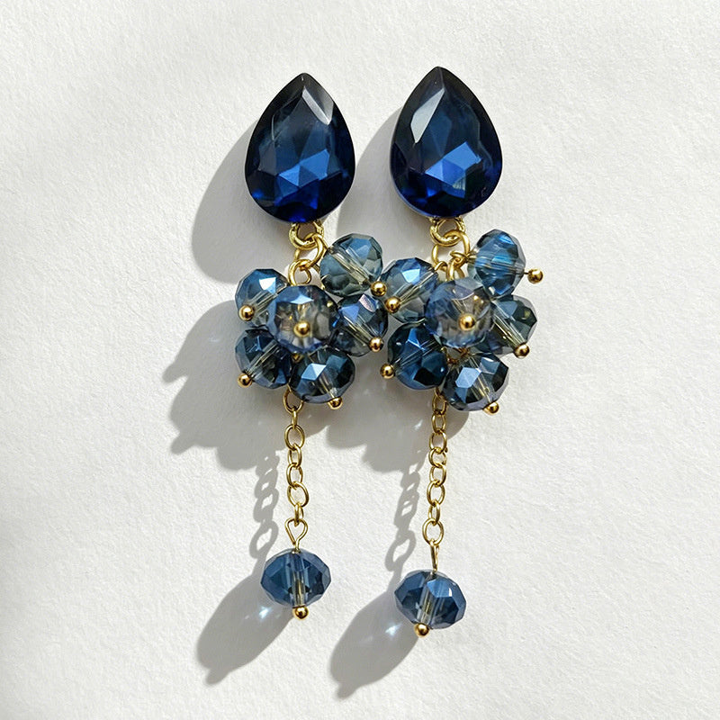Teardrop-shaped gemstone earrings with multi-layered crystal beads and long tassel design