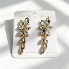 Gilt and diamond-encrusted floral earrings, long earrings for a French elegant style photo shoot or date
