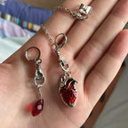 Dark-style jewelry: vintage pendant earrings, horn-shaped ruby earrings