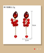 Teardrop-shaped gemstone earrings with multi-layered crystal beads and long tassel design