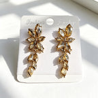 Gilt and diamond-encrusted floral earrings, long earrings for a French elegant style photo shoot or date
