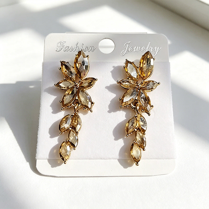 Gilt and diamond-encrusted floral earrings, long earrings for a French elegant style photo shoot or date