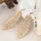 Fashionable feather for women, European American exaggerated retro cool style, stylish and unique hip-hop diamond-embellished leaf earrings