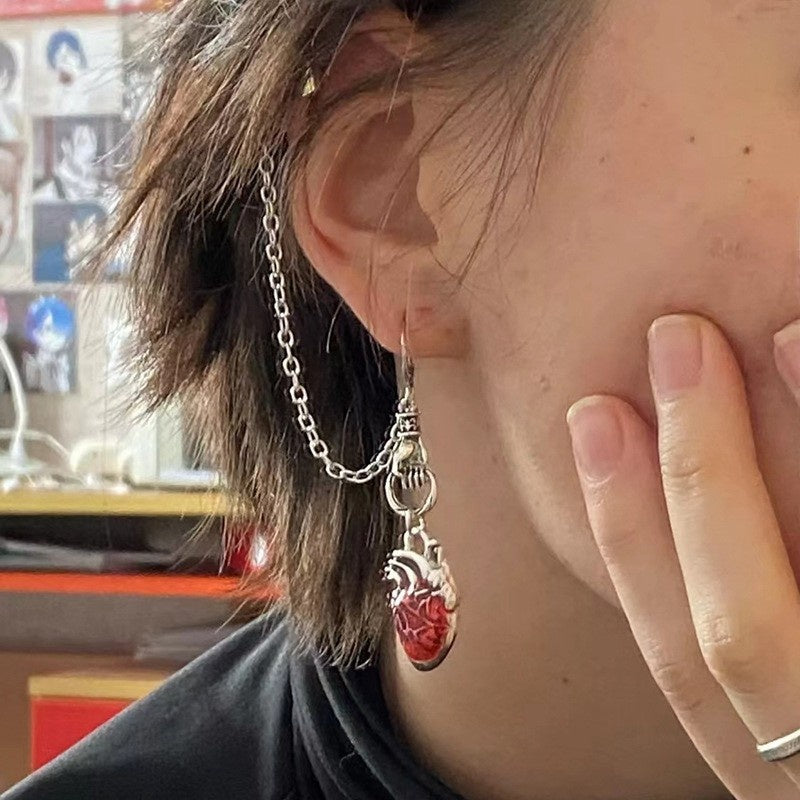 Dark-style jewelry: vintage pendant earrings, horn-shaped ruby earrings