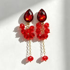 Teardrop-shaped gemstone earrings with multi-layered crystal beads and long tassel design