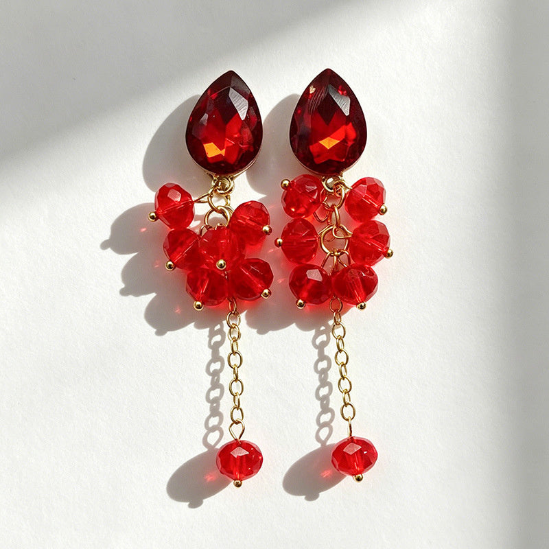Teardrop-shaped gemstone earrings with multi-layered crystal beads and long tassel design