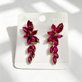 Gilt and diamond-encrusted floral earrings, long earrings for a French elegant style photo shoot or date