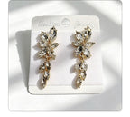 Gilt and diamond-encrusted floral earrings, long earrings for a French elegant style photo shoot or date