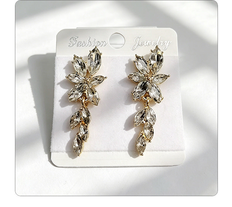 Gilt and diamond-encrusted floral earrings, long earrings for a French elegant style photo shoot or date